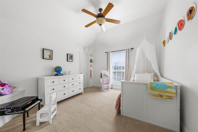 bedroom featuring ceiling fan, vaulted ceiling, and light colored carpet