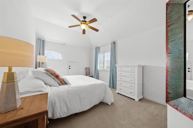 bedroom with light carpet, baseboards, lofted ceiling, and ceiling fan