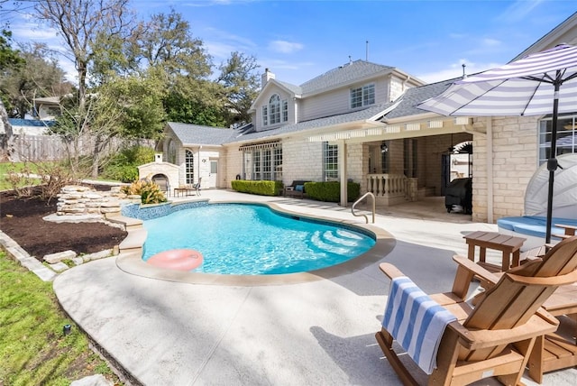 view of pool featuring a patio, a fenced in pool, and fence