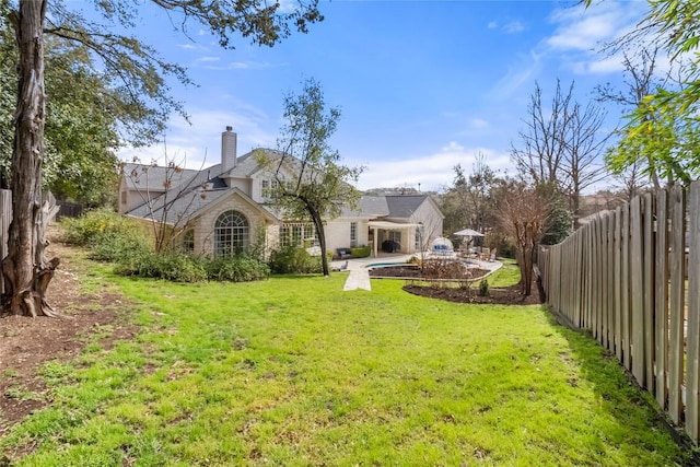 view of yard featuring a fenced backyard and a patio