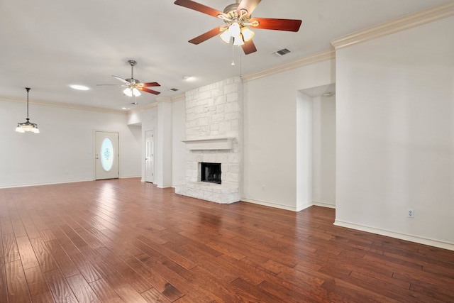183 Augusta Dr, Wimberley, TX 78676 - unfurnished living room featuring a ceiling fan, ornamental molding, wood finished floors, a fireplace, and baseboards