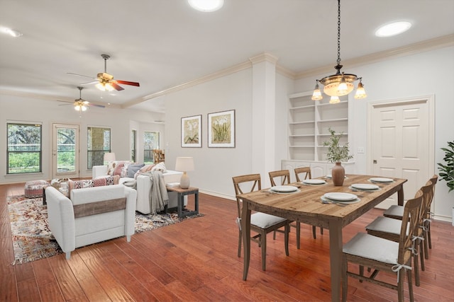 183 Augusta Dr, Wimberley, TX 78676 - dining space with hardwood / wood-style floors, ornamental molding, ceiling fan, baseboards, and built in features