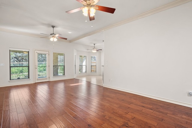 183 Augusta Dr, Wimberley, TX 78676 - unfurnished living room featuring crown molding, a ceiling fan, baseboards, and hardwood / wood-style flooring