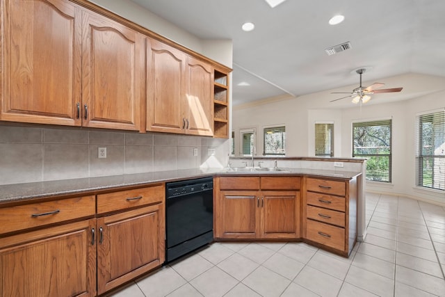 183 Augusta Dr, Wimberley, TX 78676 - kitchen featuring dishwasher, a sink, a peninsula, a ceiling fan, and brown cabinets