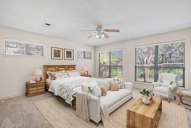183 Augusta Dr, Wimberley, TX 78676 - bedroom with light colored carpet, baseboards, and ceiling fan
