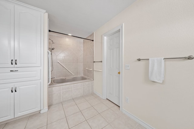 183 Augusta Dr, Wimberley, TX 78676 - bathroom with tiled shower / bath combo, tile patterned flooring, and baseboards