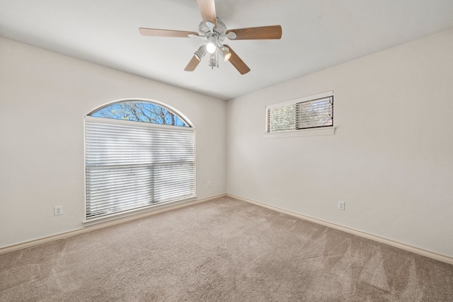 183 Augusta Dr, Wimberley, TX 78676 - carpeted empty room with healthy amount of natural light, ceiling fan, and baseboards