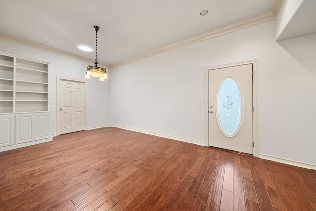 183 Augusta Dr, Wimberley, TX 78676 - entrance foyer featuring crown molding, hardwood / wood-style floors, and baseboards