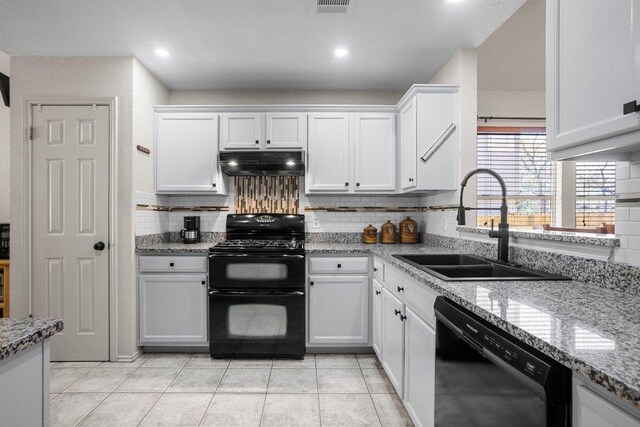 1015 Strickland Dr, Austin, TX 78748 - kitchen featuring black appliances, under cabinet range hood, a sink, decorative backsplash, and white cabinets