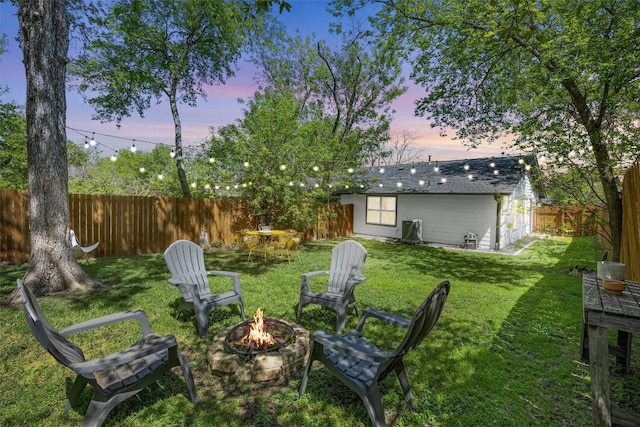 6306 Arnold Dr Unit 1, Austin, TX 78723 - yard at dusk featuring a fire pit