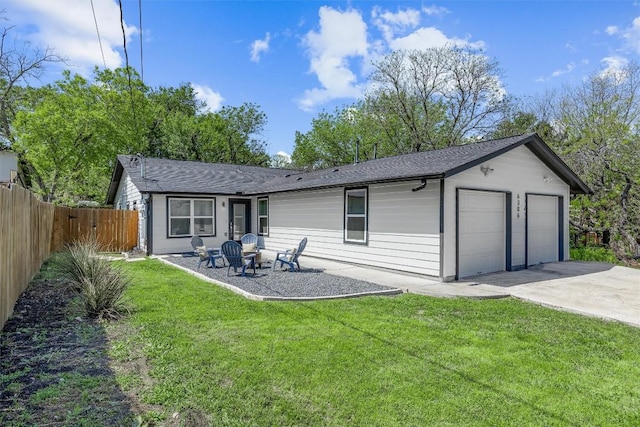 6306 Arnold Dr Unit 1, Austin, TX 78723 - rear view of house featuring a shingled roof and a detached garage