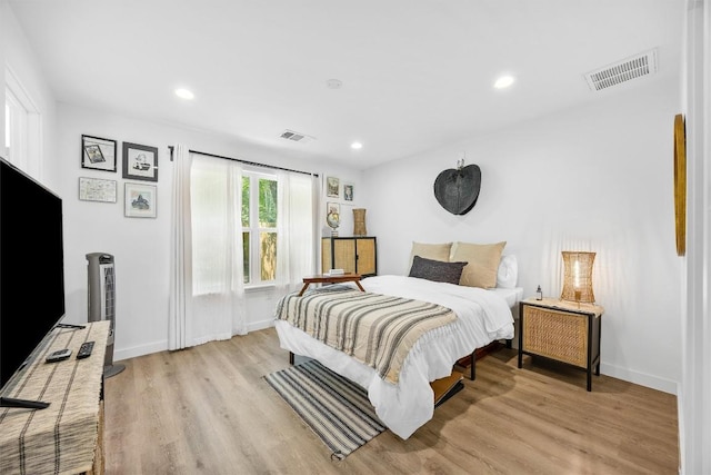 6306 Arnold Dr Unit 1, Austin, TX 78723 - bedroom with light wood-style flooring, baseboards, and recessed lighting