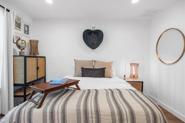 6306 Arnold Dr Unit 1, Austin, TX 78723 - bedroom with baseboards, wood finished floors, and recessed lighting