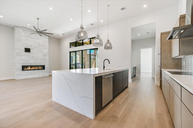 123 Azalea Loop, Horseshoe Bay, TX 78657 - kitchen with modern cabinets, wall chimney exhaust hood, dishwasher, a sink, and ceiling fan