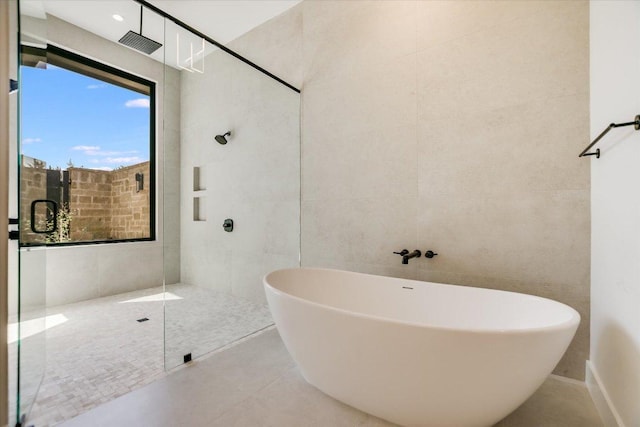 123 Azalea Loop, Horseshoe Bay, TX 78657 - full bath with a soaking tub, walk in shower, and tile walls