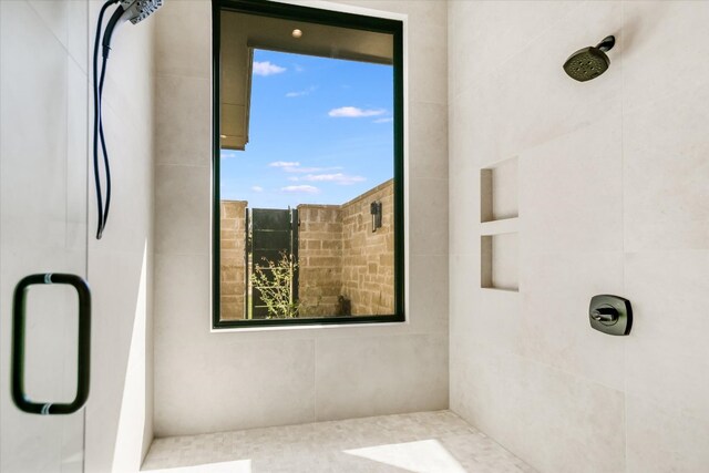123 Azalea Loop, Horseshoe Bay, TX 78657 - bathroom featuring a stall shower and healthy amount of natural light