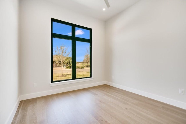 123 Azalea Loop, Horseshoe Bay, TX 78657 - spare room with light wood-style flooring, baseboards, and recessed lighting