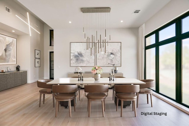 123 Azalea Loop, Horseshoe Bay, TX 78657 - dining room with light wood-style flooring and recessed lighting