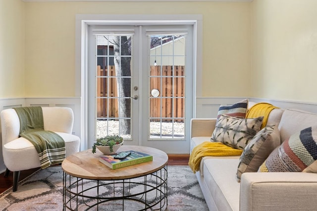 4419 Sinclair Ave, Austin, TX 78756 - sitting room with french doors, wainscoting, plenty of natural light, wood finished floors, and a decorative wall