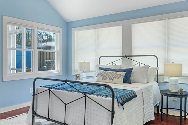 4419 Sinclair Ave, Austin, TX 78756 - bedroom featuring lofted ceiling, wood finished floors, and baseboards