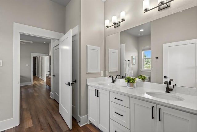 200 County Road 246, Florence, TX 76527 - bathroom featuring double vanity and wood finished floors