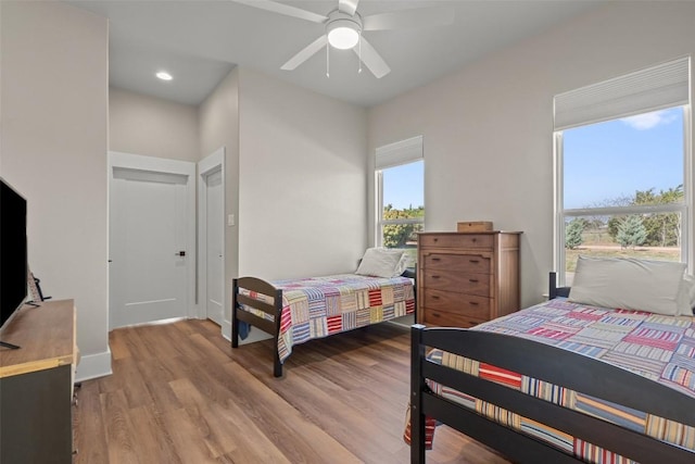 200 County Road 246, Florence, TX 76527 - bedroom with light wood finished floors, a ceiling fan, and recessed lighting