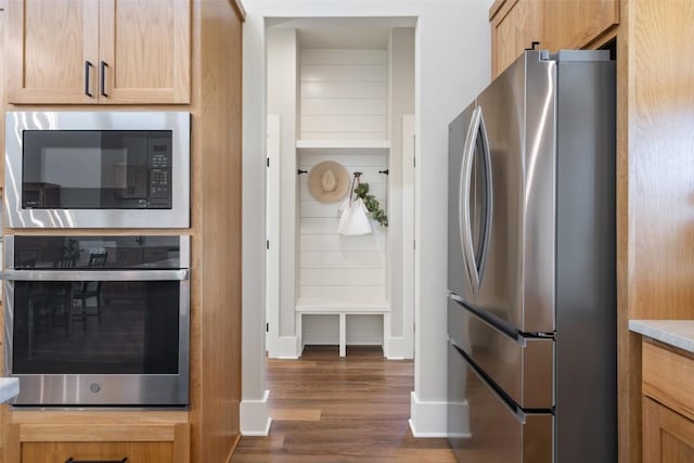 200 County Road 246, Florence, TX 76527 - kitchen featuring appliances with stainless steel finishes, wood finished floors, baseboards, and light countertops