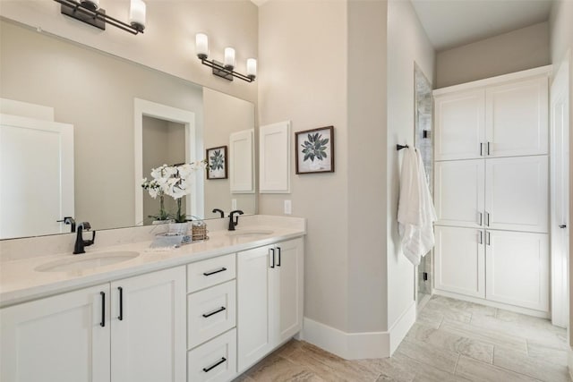 200 County Road 246, Florence, TX 76527 - full bath with double vanity and baseboards