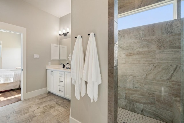 200 County Road 246, Florence, TX 76527 - ensuite bathroom featuring vanity, a walk in shower, and baseboards