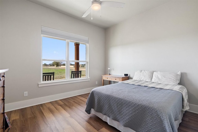 200 County Road 246, Florence, TX 76527 - bedroom with baseboards, wood finished floors, and ceiling fan