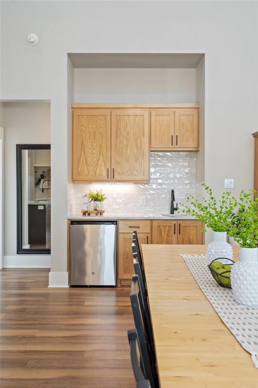 200 County Road 246, Florence, TX 76527 - kitchen with dishwasher, light brown cabinets, light countertops, and wood finished floors