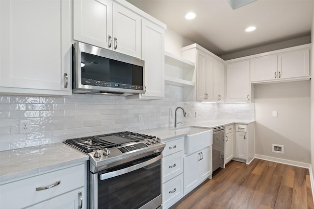 200 County Road 246, Florence, TX 76527 - kitchen featuring appliances with stainless steel finishes, open shelves, a sink, white cabinetry, and recessed lighting