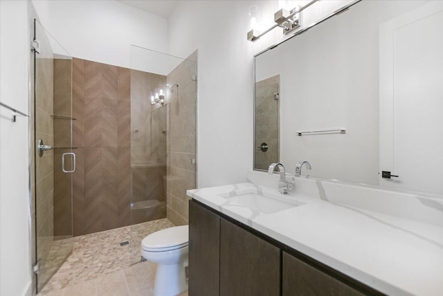 317 Azalea Ct, Horseshoe Bay, TX 78657 - bathroom featuring a shower stall, toilet, vanity, and tile patterned flooring