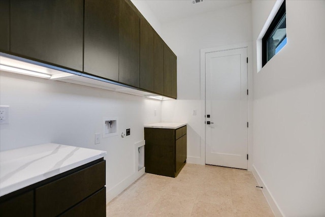317 Azalea Ct, Horseshoe Bay, TX 78657 - laundry area with cabinet space, washer hookup, and baseboards