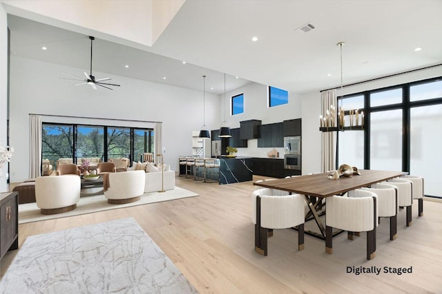 317 Azalea Ct, Horseshoe Bay, TX 78657 - dining space featuring a high ceiling, light wood-type flooring, healthy amount of natural light, recessed lighting, and ceiling fan