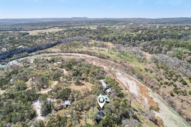 520 River Rapids Rd, Wimberley, TX 78676 - aerial view of property and surrounding area featuring a heavily wooded area