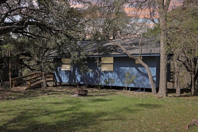 520 River Rapids Rd, Wimberley, TX 78676 - rear view of property with a lawn and an outdoor fire pit