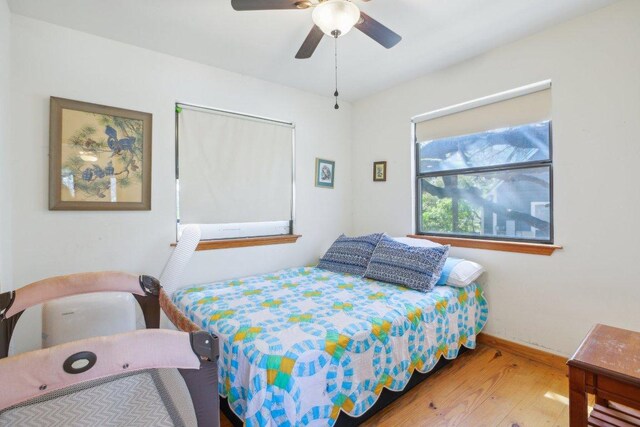 520 River Rapids Rd, Wimberley, TX 78676 - bedroom featuring wood finished floors and ceiling fan