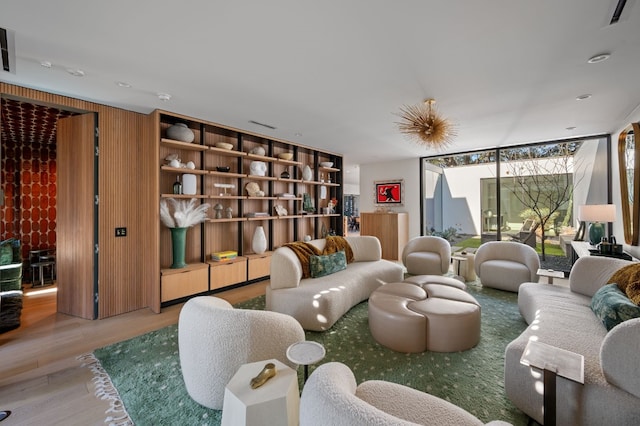 701 W Elizabeth St, Austin, TX 78704 - living room featuring wood finished floors and a wall of windows