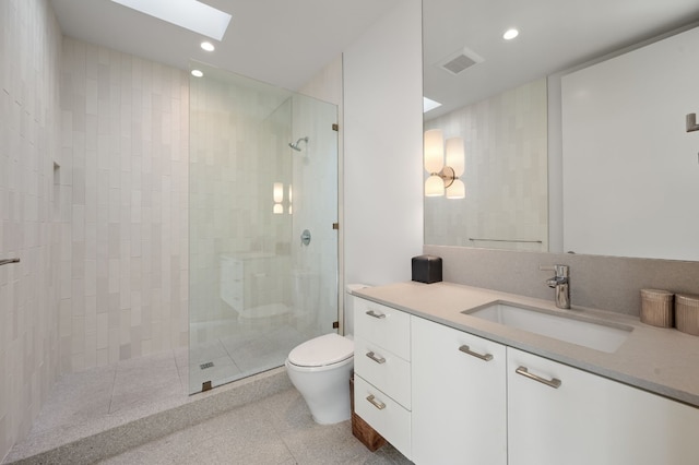 701 W Elizabeth St, Austin, TX 78704 - full bath featuring vanity, walk in shower, a skylight, and recessed lighting
