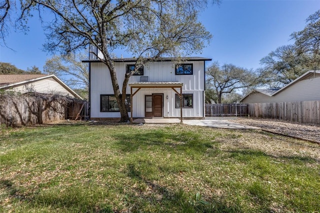 4209 Everest Ln, Austin, TX 78727 - rear view of property with a patio, a fenced backyard, and board and batten siding