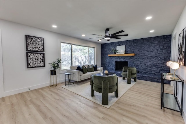 4209 Everest Ln, Austin, TX 78727 - living area with light wood-type flooring, a ceiling fan, recessed lighting, and a stone fireplace