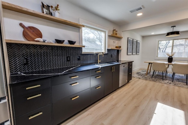 4209 Everest Ln, Austin, TX 78727 - kitchen with open shelves, stainless steel dishwasher, dark countertops, dark cabinetry, and recessed lighting
