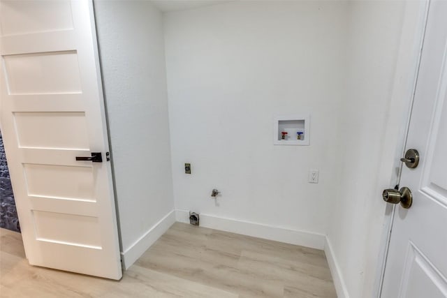 4209 Everest Ln, Austin, TX 78727 - laundry room featuring light wood-style floors, washer hookup, electric dryer hookup, and hookup for a gas dryer