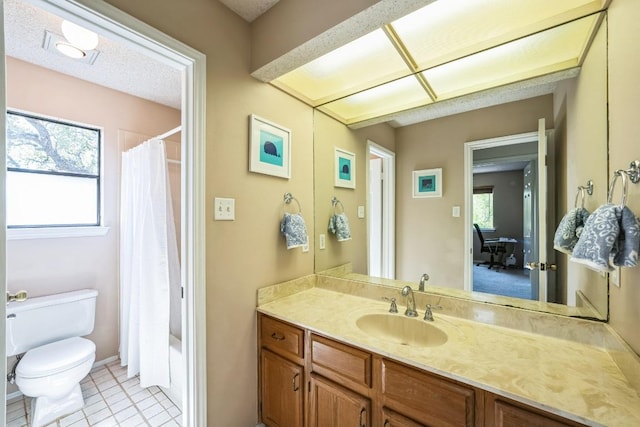 full bathroom featuring tile patterned floors, shower / tub combo, toilet, and vanity