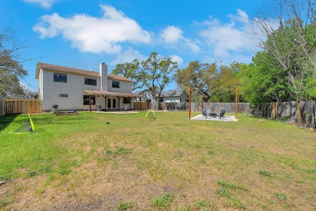 view of yard featuring a fenced backyard and a patio area