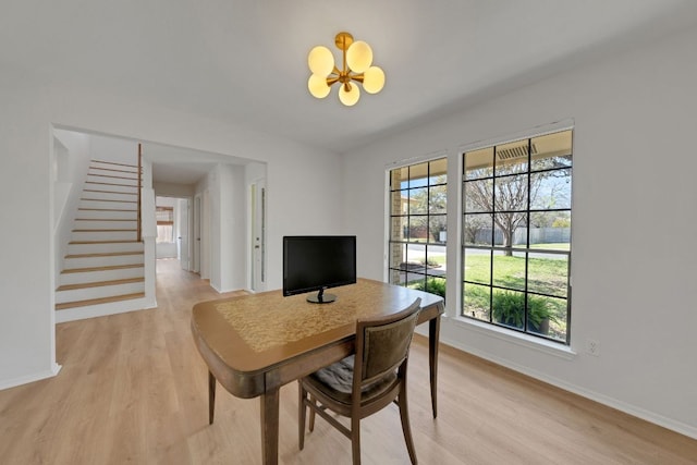 office with baseboards and light wood-type flooring
