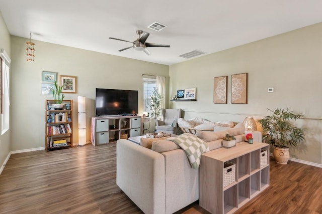 14128 Sandrock Bnd, Pflugerville, TX 78660 - living area with dark wood-style flooring, a ceiling fan, and baseboards