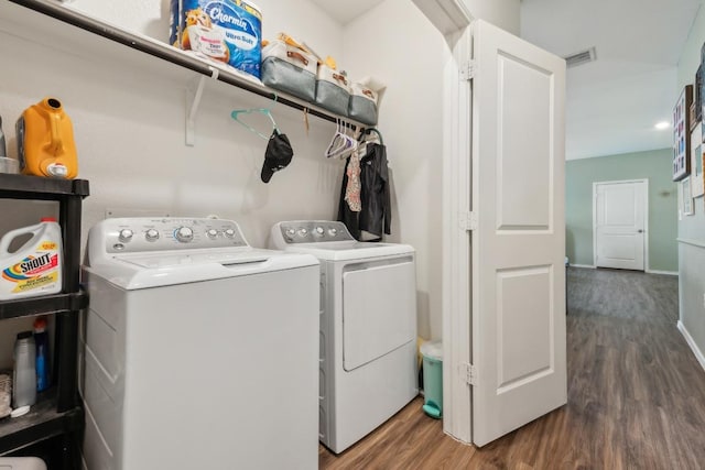 14128 Sandrock Bnd, Pflugerville, TX 78660 - laundry room with separate washer and dryer, wood finished floors, and baseboards