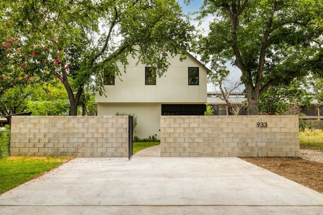 933 E 52nd St, Austin, TX 78751 - view of property exterior with stucco siding and a patio area